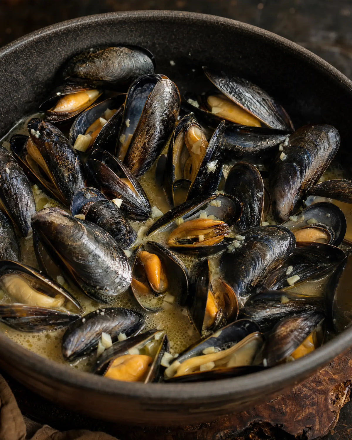Mussels in Garlic Butter — A pound of mussels, butter, garlic, and a ladle of bone broth...