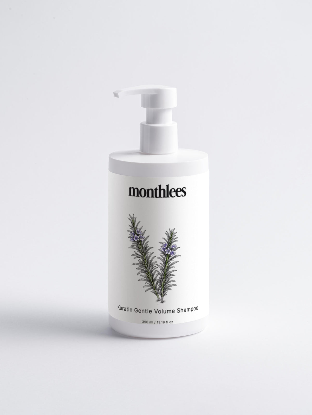 Shampoo bottle with 'monthlees' branding and botanical design on a light gray background