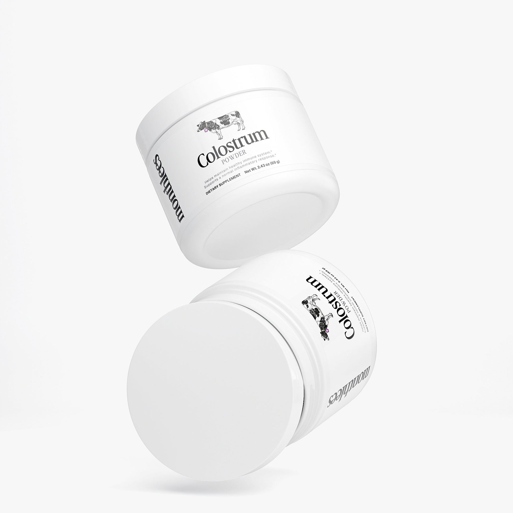 Two white containers labeled 'Colostrum' on a light gray background